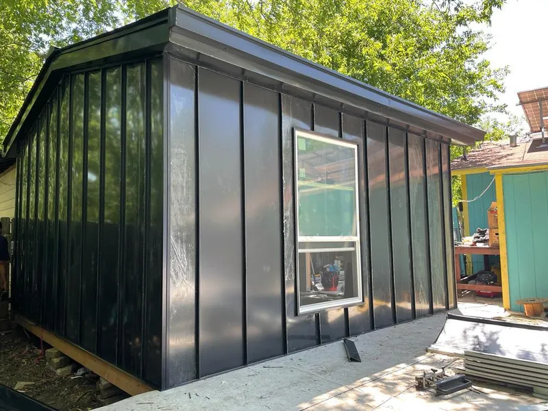 Black standing seam metal wall panels for Roof Inspection in Lockport