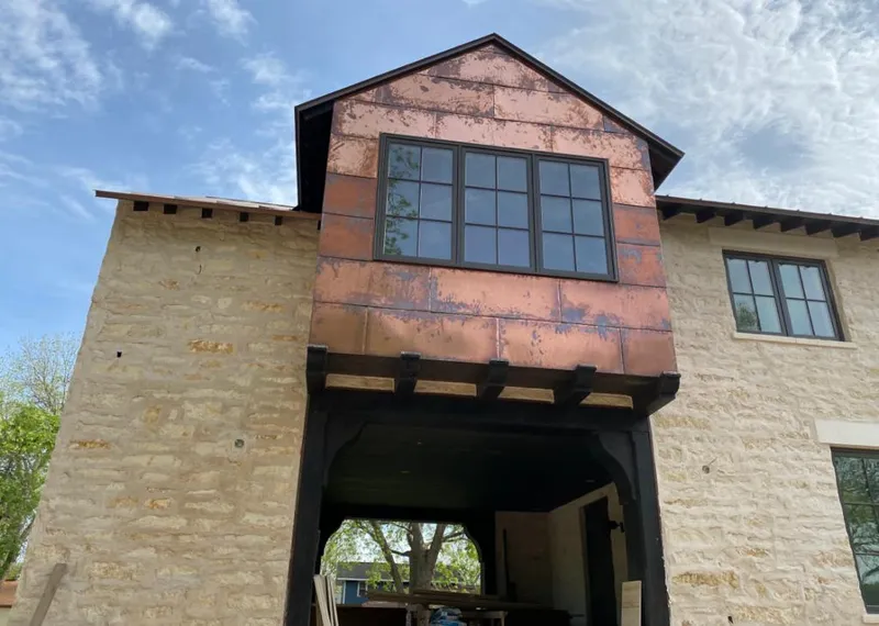 Copper metal panel facade on a stone building for Metal Roof Coating in Lockport